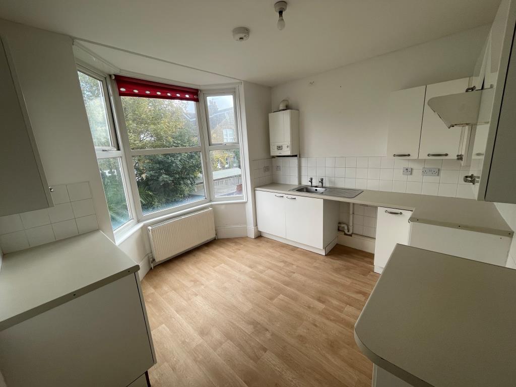 Lot: 110 - PROPERTY ARRANGED AS TWO FLATS - Kitchen with bay window